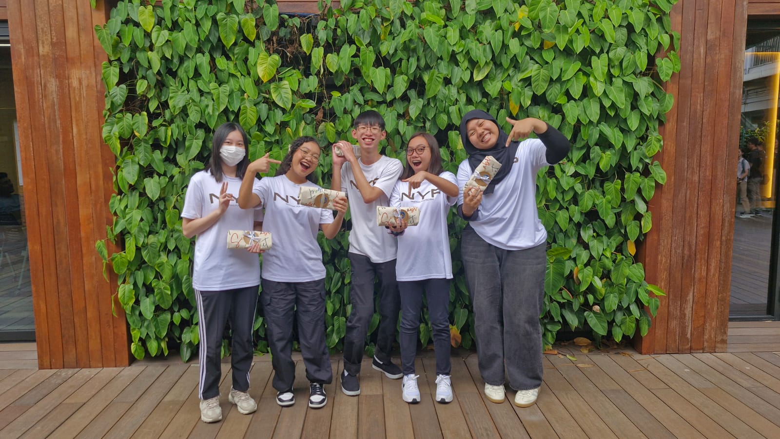 Students preparing Vietnamese spring rolls using sustainable ingredients