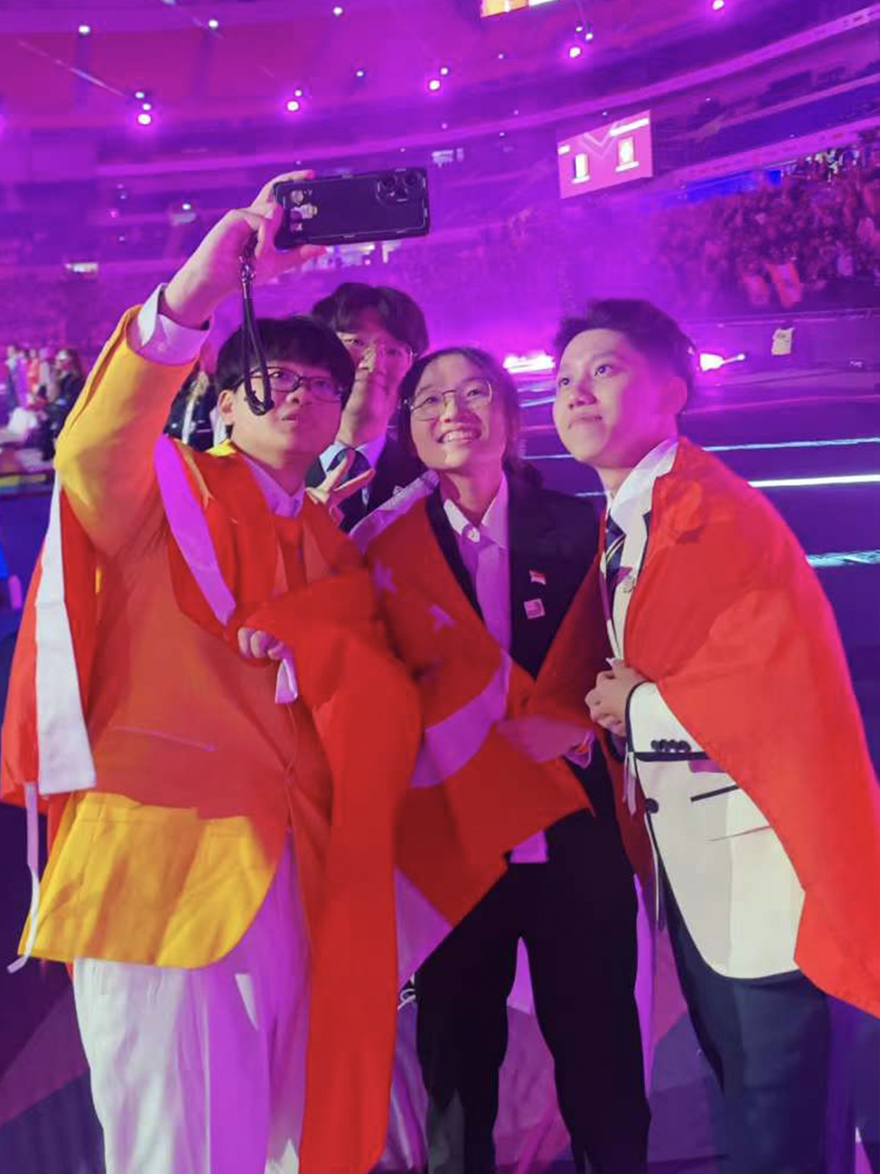 Shi Qi taking a picture with new friends at WorldSkill Lyon 2024.